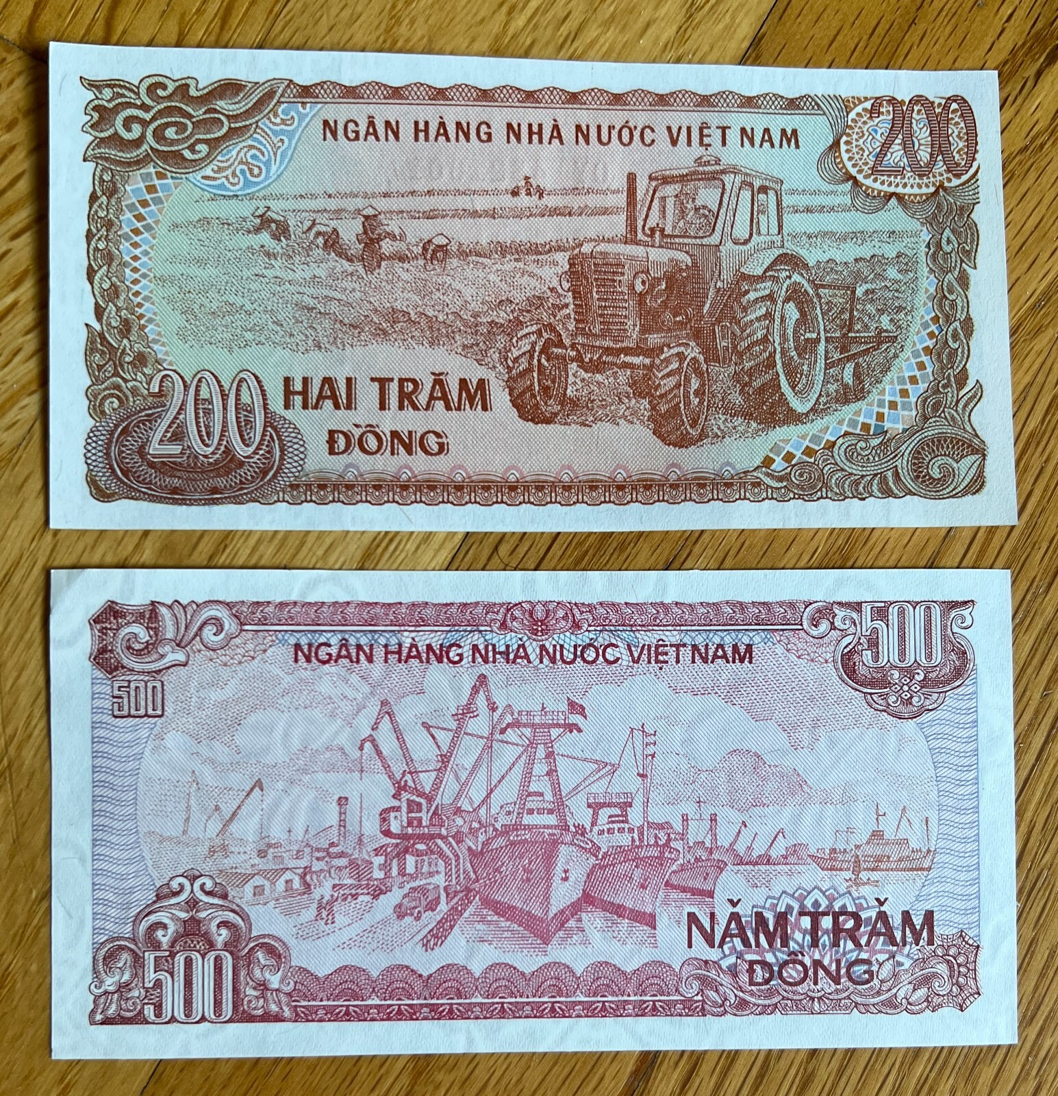2 crisp uncirculated Vietnam notes 200 and 500 dong