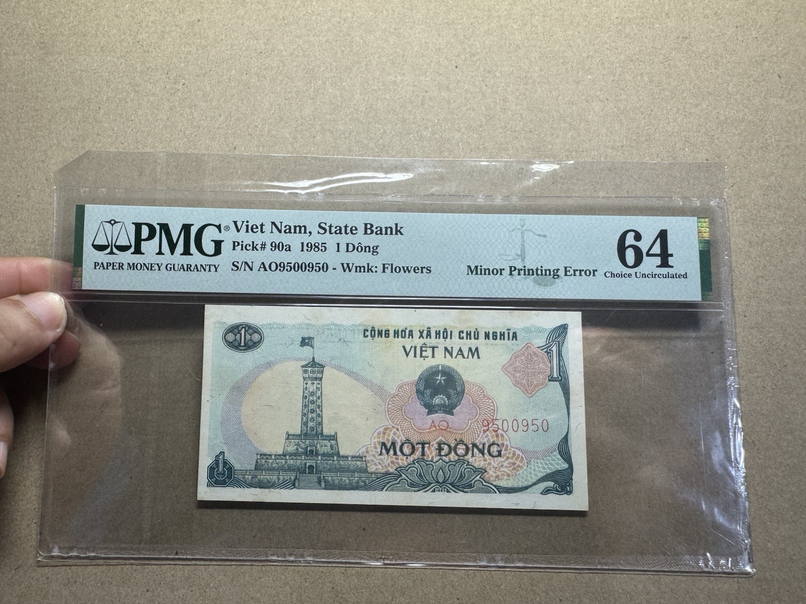 Top Pop Minor Printing Error 1 Đồng 1985 PMG-64 Very Rare_LDP.