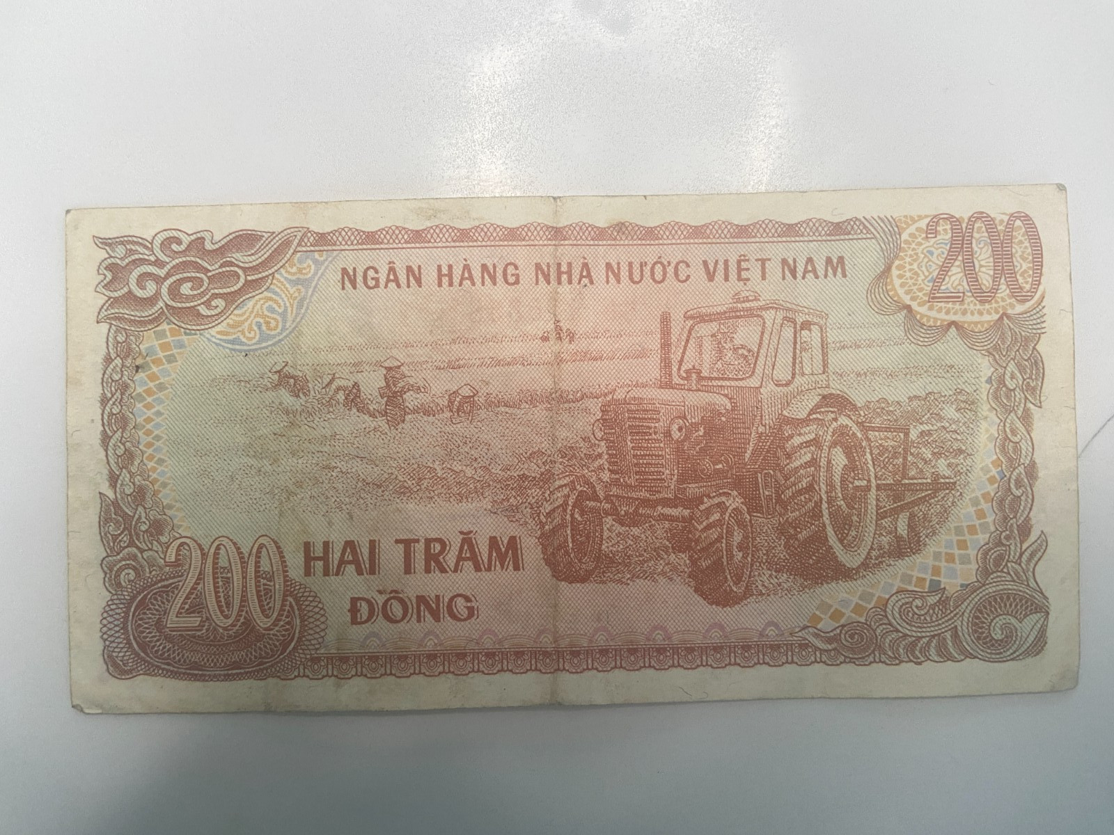 Vietnam 200 Đồng Banknote – State Bank of Vietnam – Ho Chi Minh – Tractor Scene